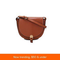 in stock Chic Cognac Saddle Bag With Gold-tone Hardware, Chic Cognac Saddle Shoulder Bag, Textured Leather Rectangular Saddle Bag, Elegant Saddle Bag With Adjustable Strap For Shopping, Trendy Brown Saddle Bag For Shopping, Rectangular Textured Leather Saddle Bag, Saddle Bag With Adjustable Strap For Shopping, Brown Saddle Bag With Gold-tone Hardware For Shopping, Chic Cognac Crossbody Satchel