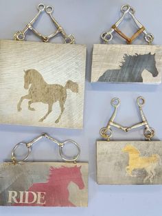 four pieces of wood with horses on them and the words ride are hanging from hooks