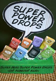 there are many different colored boxes in front of a sign that says super power drops