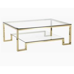 a glass and brass coffee table with two shelves