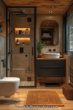 a bathroom with a toilet, sink and shower stall in it's own area