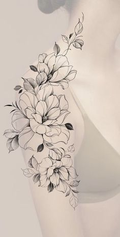 a woman's arm with flowers on it, and the back of her body