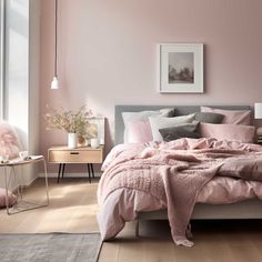 a bedroom with pink walls and bedding in the center, along with two nightstands