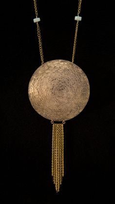 If you want bold, dynamic and elegant, this statement piece of jewelry is for you. Featuring a large hammered brass disc, adventurine, chain, and a handmade hook clasp. Luxury Round Brass Necklace, Hammered Brass Coin Pendant Necklace, Hammered Brass Medallion Coin Necklace, Handmade Long Brass Chain Necklace, Handmade Round Brass Chain Necklace, Bronze Brass Coin Necklace With Round Pendant, Bronze Brass Coin Pendant Necklace, Handmade Brass Medallion Necklace With Round Pendant, Bronze Brass Coin Necklace