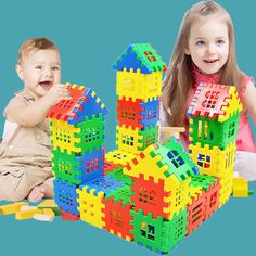 two children playing with colorful building blocks