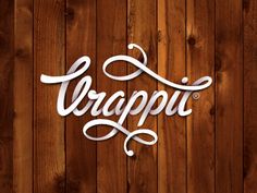 a wooden wall with the word arappi written in cursive writing