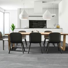 a dining room table with four chairs around it