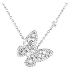 A playful bauble with a graceful shine, this diamond butterfly necklace is the perfect choice for days that require an extra dose of glitter. The necklace features an 18 chain in solid 18K white gold, holding a 0.75-wide pendant in the shape of a butterfly. A mix of round and square diamonds adorn the butterfly's wings, while its body is punctuated by a marquise diamond.This brand new LB Exclusive 18K White Gold 0.90ct Diamond Cluster Butterfly Necklace comes in a gift box. Diamond Butterfly Necklace, Diamond Butterfly, Square Diamond, Marquise Diamond, Butterfly Necklace, Diamond Cluster, A Butterfly, Butterfly Wings, Jewelry Necklace Pendant