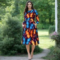 This vibrant butterfly print dress is designed for those who love to make a bold and unique fashion statement. The dress features a stunning array of colorful butterflies, creating a beautiful and eye-catching pattern that is perfect for any season. Made from soft, comfortable fabric, this mid-length dress includes practical pockets and long sleeves, making it both stylish and functional. The inspiration behind this dress came from the beauty of nature and the enchanting allure of butterflies. I Blue Butterfly Print Casual Dress, Multicolor Butterfly Print Summer Dress, Summer Butterfly Print Multicolor Dresses, Summer Multicolor Butterfly Print Dress, Fitted Multicolor Butterfly Print Dress, Butterfly Print Dress, Whimsical Dress, Vibrant Dress, Robes D'occasion