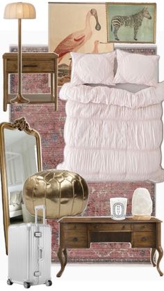 a bedroom with pink and gold decor on the walls, bedding, mirror, dresser, lamp, suitcase