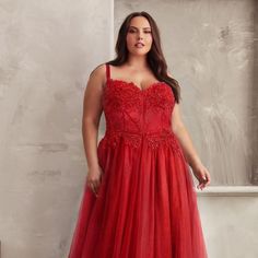 This Enchanting Dress Combines Ethereal Tulle, Delicate Floral Lace, And Expert Craftsmanship, Ensuring You Radiate Timeless Elegance And Sophistication. The A-Line Silhouette Of This Dress Flows Gracefully From The Waist, Creating A Universally Flattering Look That Enhances Your Curves And Flatters All Body Types. The Sleeveless Design Showcases Your Arms And Shoulders, Adding A Touch Of Femininity And Making It Perfect For Any Formal Occasion. Fabric: Tulle Length: Long Color: Red Neckline: Sw Red Floor-length Dress With Lace Bodice, Sleeveless Red Tulle Dress, Red Sleeveless Tulle Dress, Red Lace Sleeveless Evening Dress, Red Sleeveless Lace Evening Dress, Sleeveless Evening Gown For Festive Occasions, Red Sleeveless Gown With Fitted Bodice, Red Lace Sleeveless Dress, Festive Sleeveless Dress With Fitted Bodice