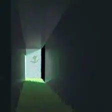 an open door in the middle of a dark hallway