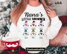 🎄❤️ Celebrate the love of family with our "Personalized Nana's Little Snowmen Sweatshirt"! 👵❄️ Customize it with your grandkids' names as a heartwarming Christmas gift for the cherished grandma in your life. Share holiday warmth and love together! 🌟👚 #NanaLove #HolidayCheer ️ Custom Grandma Christmas Sweatshirt has a loose fit for a comfortable feel. Super soft cotton and excellent quality print make one to fall in love with it over and over again. Personalized Nana's Little Snowmen, Custom Grandma Christmas Sweatshirt, Grandkids name Sweatshirt, Nana Sweatshirt, Gift For Nana FEATURES (Sweatshirt) - Loose fit - 50% Cotton; 50% Polyester (Fibre content may vary for different colors) - Medium fabric (8.0 Oz/yd² (271.25 g/m - Sewn in label - Runs true to size CARE INSTRUCTIONS (Sweatshir Personalized White Tops For Winter, Nana Sweatshirt, Name Sweatshirt, Love Of Family, Grandma Christmas, Grandmas Christmas, Nana Gifts, Christmas Sweatshirts, Sew-in Labels