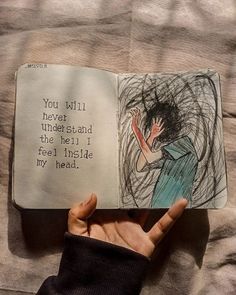 someone is holding an open book in their hand with the words you will never stand on the hell if feel inside my head