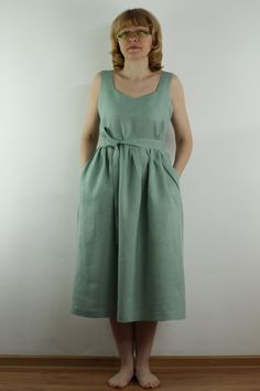 "Handmade minty green linen dress sleeveless, with 2 pockets, belt, perfect for casual wear and suitable for any occasion in summer season Details: - 100% natural linen produced in Europe ; - medium weight (180 gram per square meter); - color: could be any from our colors catalogue (color samples at the photo); Made to order, approximately a few days, If you have any questions please message me and I will be glad to answer. Size guide : Size XS Bust: fits bust around 33\"-34\"/ 84-88 cm Waist: f Light Green V-neck Summer Dress, Light Green Knee-length Summer Dress, Casual Green Midi-length Sleeveless Dress, Casual Light Green Sleeveless Dress, Casual Light Green Knee-length Dress, Elegant Sleeveless Light Green Dress, Green Cotton Midi-length Sleeveless Dress, Green Cotton Midi Length Sleeveless Dress, Green Cotton Sleeveless Midi Dress