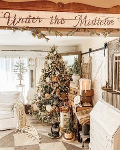 a decorated christmas tree in the corner of a living room