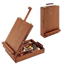 two wooden boxes with different types of paint and pencils in them on a white background