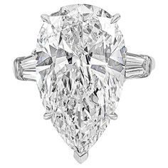 A classic Harry Winston diamond engagement ring, showcasing a 12.00 carats pear shape diamond certified by GIA as F color and VVS2 clarity. Flanked by tapered baguette diamonds weighing 1.35 carats total. Stamped by Jacques Timey, a well-renowned maker of Harry Winston jewelry. Harry Winston Ring, Harry Winston Jewelry, Round Brilliant Engagement Ring, Round Diamond Engagement Rings Solitaire, Harry Winston Diamond, Pear Shaped Diamond Ring, Indoor Rabbit, Lady Luxury, Pear Diamond Rings