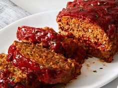 meatloaf with cranberry sauce on a white plate