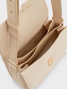 Beige Saddle Shoulder Bag With Adjustable Strap, Trendy Beige Business Satchel, Trendy Beige Satchel For Business, Versatile Beige Shoulder Bag For Business, Modern Beige Saddle Bag For Travel, Beige Satchel Saddle Bag With Adjustable Strap, Modern Beige Saddle Bag With Adjustable Strap, Beige Saddle Bag Satchel With Adjustable Strap, Everyday Beige Crossbody Saddle Bag