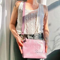 Lavender Light Purple Crossbody Bag Engraved in Cursive Font Name on a model wearing ann taylor top. Genuine Leather Purse for Daughter or  Niece. Customized Leather Purse for Her. Everyday Crossbody Shoulder Bag With Engraved Logo, Modern Leather Bag With Monogram Print, Luxury Crossbody Bag With Engraved Logo, Monogram Canvas Crossbody Shoulder Bag With Gold-tone Hardware, Purple Leather-handled Crossbody Bag, Anniversary Surprise, Wedding Party Gift, Crossbody Purse, Personalized Monogram