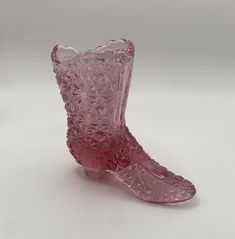 This pink collectible Fenton glass shoe figurine is a unique addition to a collection or as a standalone decor item. There's a beautiful daisy and button pattern throughout the figurine.  Measurements: L 4.5" x W 1.5" x H 4" Glass Shoe, Glass Shoes, Heel Boot, Fenton Glass, High Heel Boots, Collectible Figurines, High Heel, Heeled Boots, Decorative Items