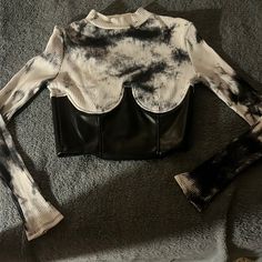 Corset Top, The Black Part Is A Vinyl Material With A Zipper On The Side. Never Worn. Size Med But Id Say Its A Small. White Fitted Edgy Crop Top, Edgy White Fitted Crop Top, Fitted Long Sleeve Black And White Tops, Fitted Black And White Long Sleeve Tops, Fitted Black And White Top For Spring, Fitted Black And White Tops For Party, Fitted Black And White Party Tops, Stage Outfit, Stage Outfits