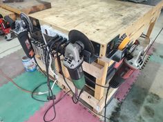 a workbench with many different tools on it