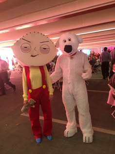 two people in costumes standing next to each other