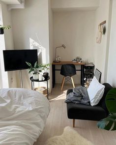 a living room filled with furniture and a flat screen tv