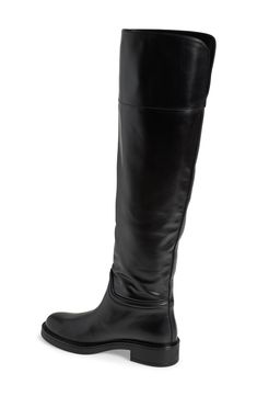 A classic riding boot takes a dramatic turn with smooth leather composition and an over-the-knee silhouette. 1 3/4" heel 20 1/2" shaft; 14" calf circumference Pull-on style Leather upper/synthetic lining and sole Made in Spain Classic Wide Calf Knee-high Boots For Riding, Elegant Wide Calf Knee-high Riding Boots, Elegant Wide Calf Knee-high Boots For Riding, Classic Knee-high Boots In Calf Leather, Classic Wide Calf Knee-high Boots In Calf Leather, Classic Calf Leather Wide Calf Knee-high Boots, Elegant Wide Calf Riding Boots, Classic Riding Knee-high Boots Medium Width, Riding Knee-high Boots With Leather Sole