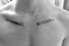 a man with two roman numeral tattoos on his chest