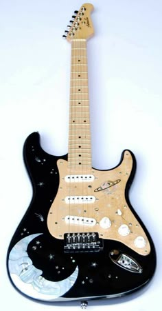 an electric guitar with black body and white frets on it's neck, in front of a white background