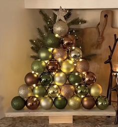 a christmas tree made out of ornaments in a living room