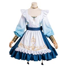 a dress with blue and white ruffles on the bottom, and gold trim