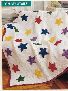 a crocheted blanket with stars on it