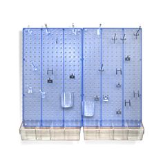 three blue pegboard displays with hooks and cups