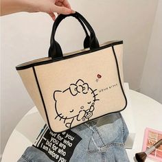 Hello Kitty Canvas Tote, Cosmetic Organizer, Travel Handbag With Faux Leather Details, Inside Pocket, Zipper Closure, Beige Lining. Cheap Hello Kitty Print Rectangular Shoulder Bag, Hello Kitty Canvas, Travel Handbag, Travel Handbags, Cosmetic Organizer, Travel Organization, Leather Handles, Outdoor Travel, Black Cream