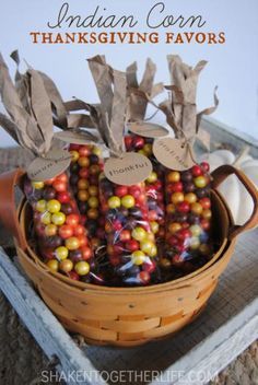 a basket filled with candy corn on top of a table