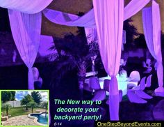 an image of a backyard party with purple and white drapes on the canopy, tables and chairs