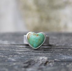 🌟PLEASE READ the following description before making your purchase. Note measurements and size reference photos. Green Kingman turquoise heart sterling silver ring 14mm American mined green Kingman turquoise heart is set in pure silver supported by a nice weight 7mm wide sterling silver band.   Perfect size ring to make a statement without being large and cumbersome to wear. Rustic Sterling Silver Turquoise Ring Gift, Western Style Turquoise Ring, Opal Nose Stud, Vert Turquoise, Wide Band Ring, Turquoise Heart, Jewelry Sale, Wide Band Rings, Kingman Turquoise