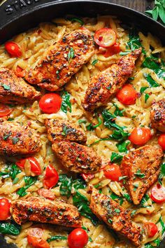 chicken and pasta with tomatoes in a skillet