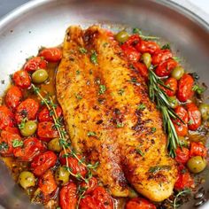 chicken with tomatoes and olives in a pan