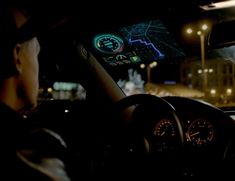 a man is driving his car at night