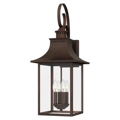 an outdoor light fixture with three lights on the front and side of it, hanging from a