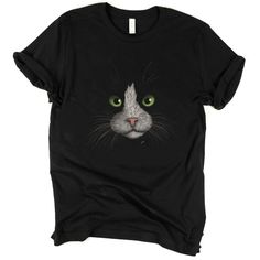 a black t - shirt with an image of a cat's face on it