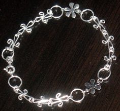 Sterling silver snowflake and fancy wire bracelet chain with Spring Ring Clasp  - 7 1/2 inches Whimsical Hypoallergenic Silver Jewelry, Whimsical Silver Bracelet Jewelry, 15 Necklace, Diy Necklace Making, Silver Snowflakes, Ball Chain Necklace, Bracelet Chain, Wire Bracelet, Silver Flowers