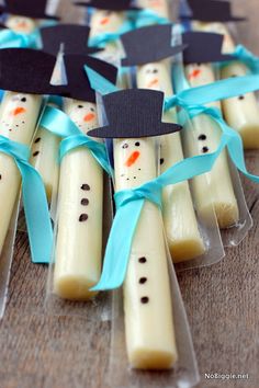 some kind of thing that looks like toothpicks with snowmen on them and blue ribbon