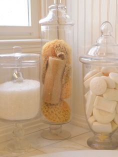 a bunch of food that is sitting on a counter next to some jars and containers