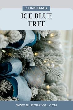 a christmas tree with blue and silver ornaments on it, text reads christmas ice blue tree